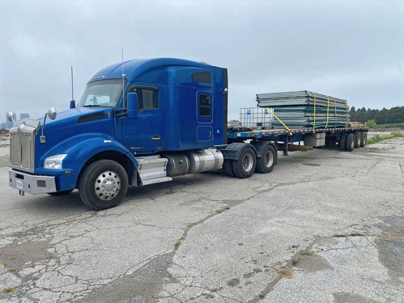 Loaded Novalight flatbed truck parked in the yard
